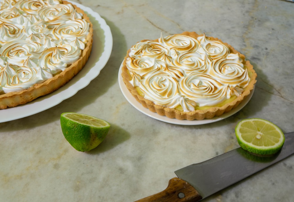 brown wooden handled knife on white round pie