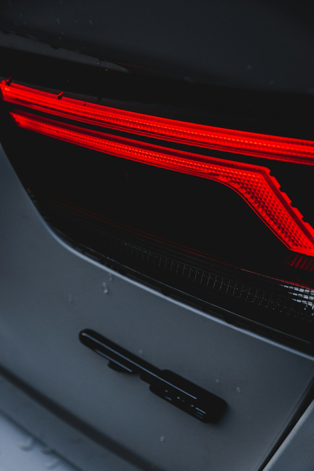 white car with red and black lights