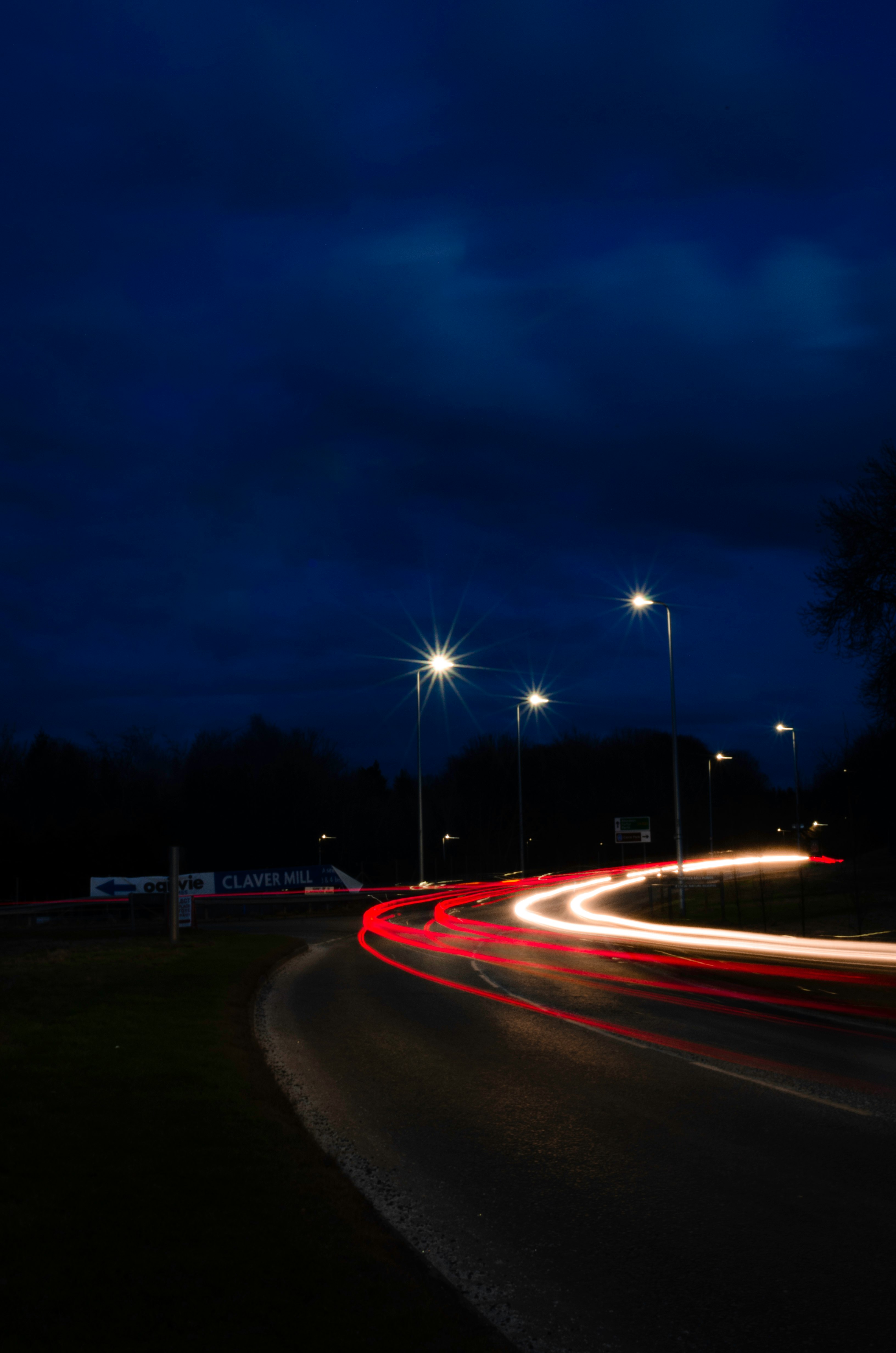 time lapse photography of cars on road during night time