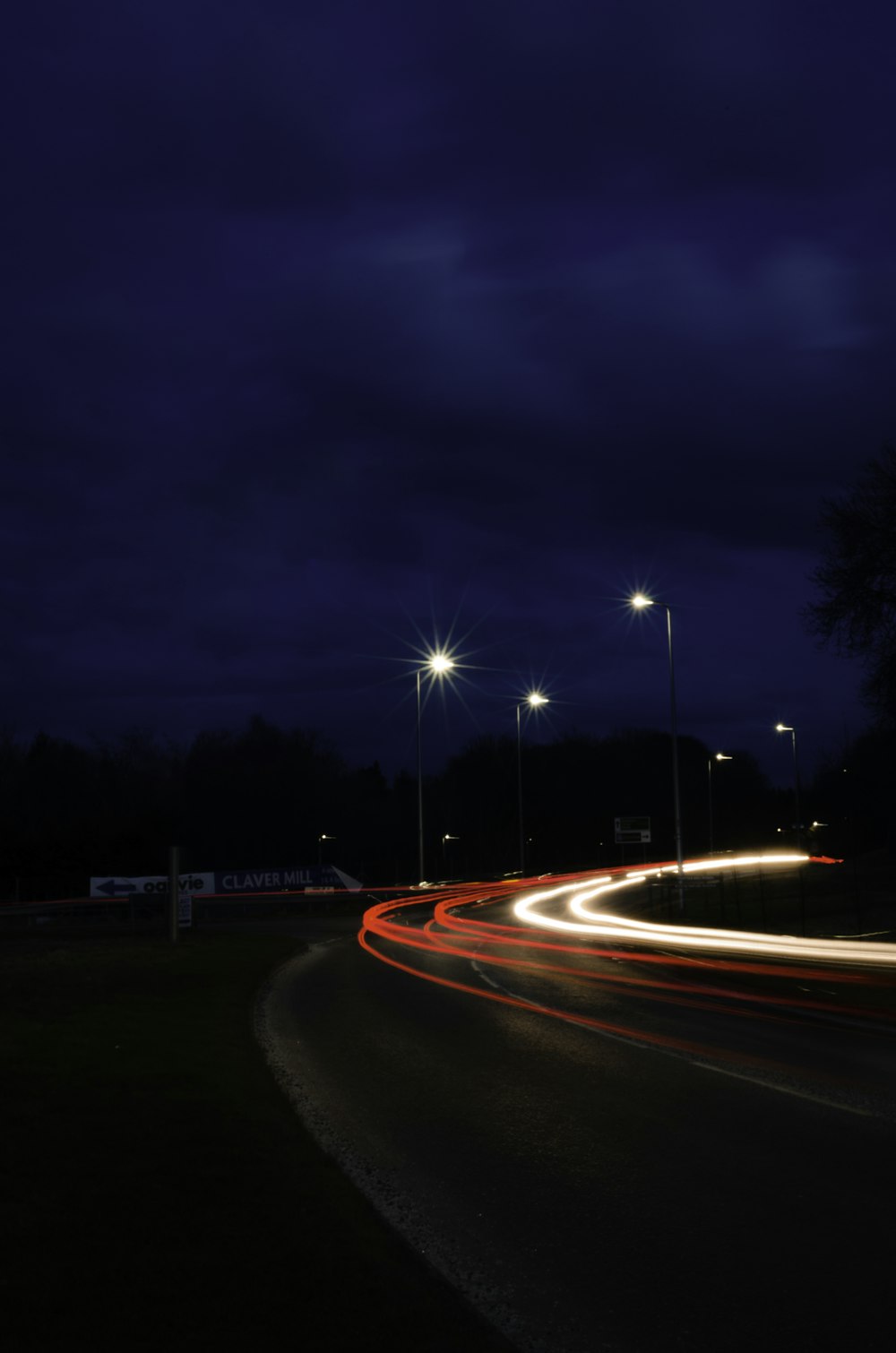 time lapse photography of cars on road during night time