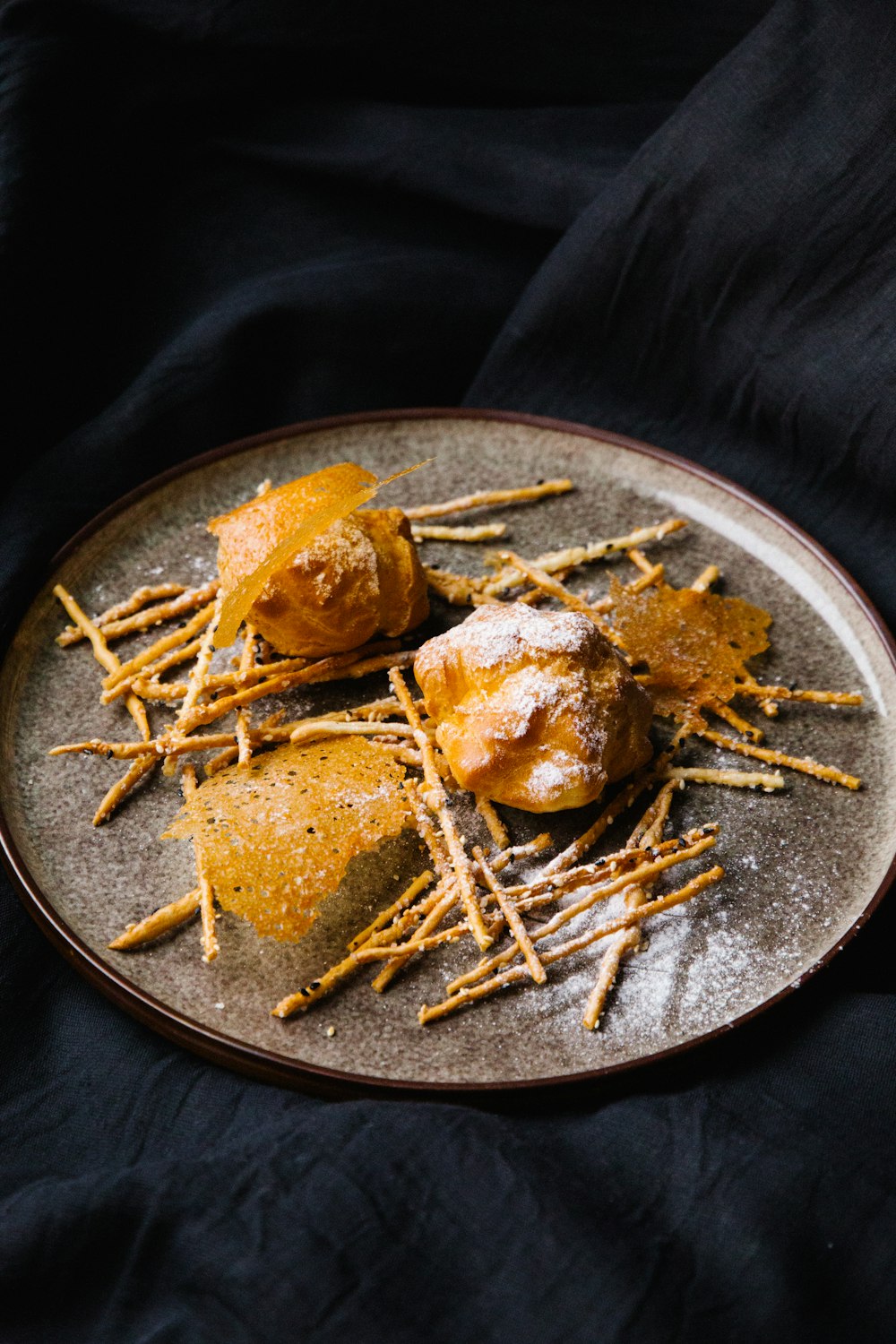 brown bread on black round plate