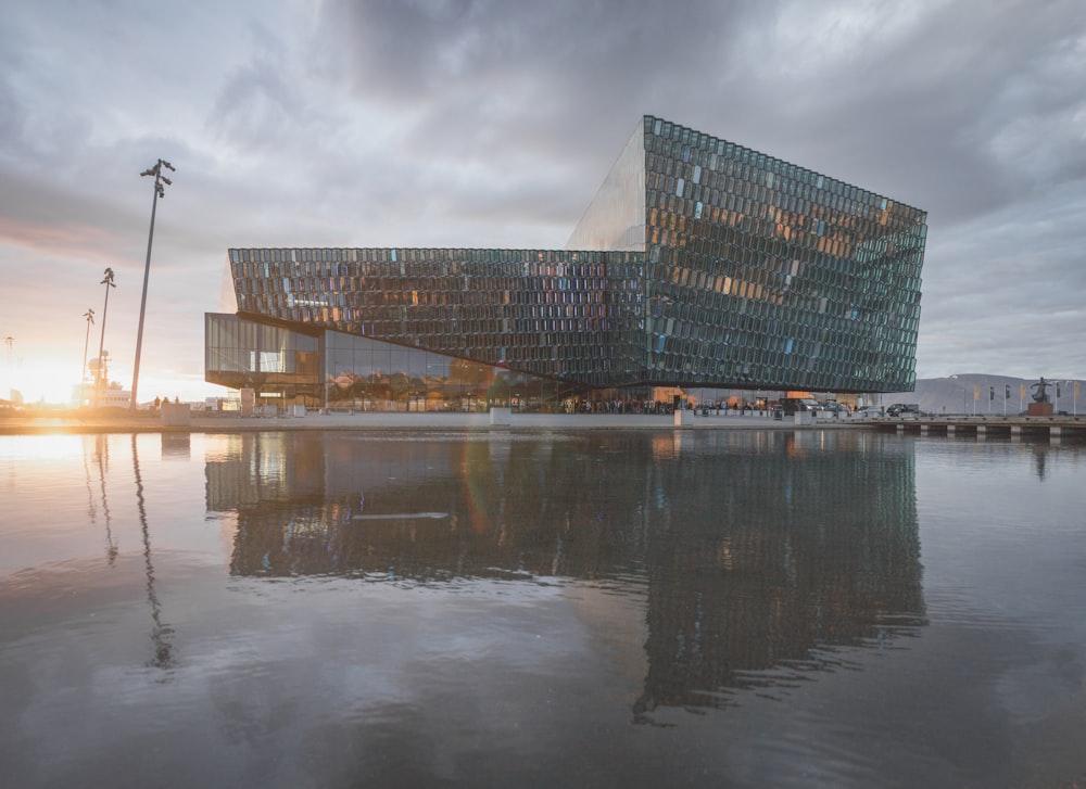 brown and blue building near body of water during daytime