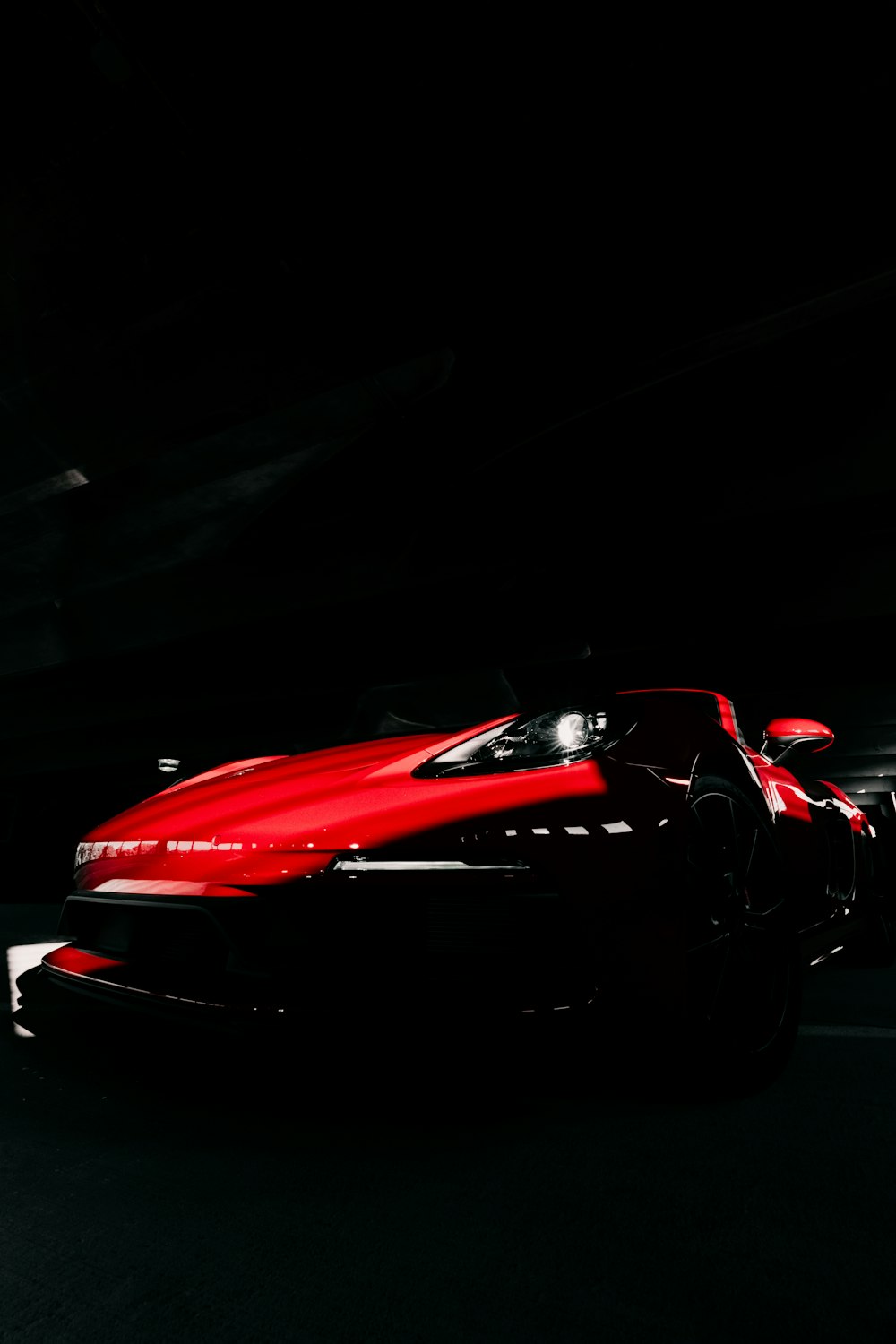 red ferrari 458 italia on black background