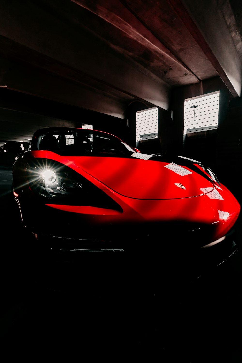 red ferrari 458 italia parked in garage