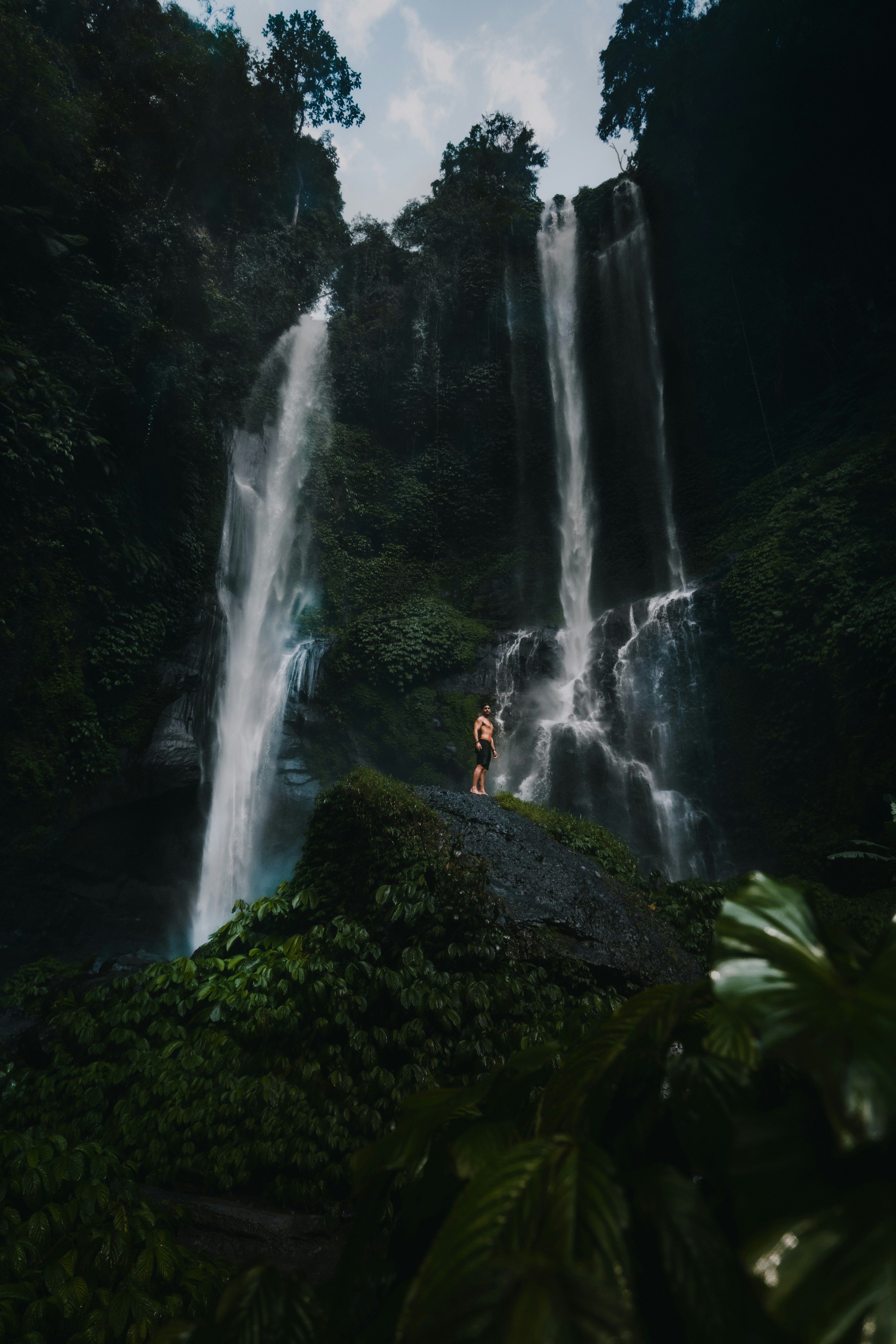 A family hiking to a beautiful Maui waterfall