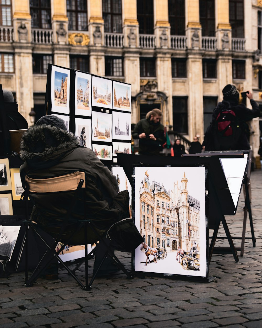 woman in black jacket sitting on black chair