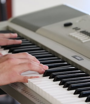 person playing piano inside room