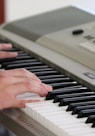 person playing piano inside room