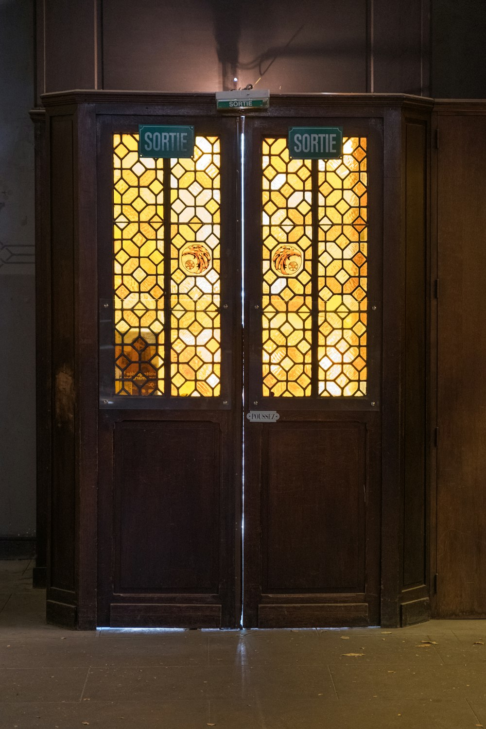 brown wooden door with glass