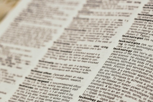 A close-up view of a dictionary page focusing on words related to 'technology.' The text is clear, with bold headings for each term and line-by-line definitions.