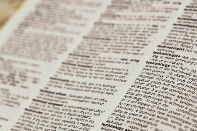 A close-up view of a dictionary page focusing on words related to 'technology.' The text is clear, with bold headings for each term and line-by-line definitions.