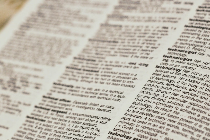 A close-up view of a dictionary page focusing on words related to 'technology.' The text is clear, with bold headings for each term and line-by-line definitions.