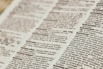 A close-up view of a dictionary page focusing on words related to 'technology.' The text is clear, with bold headings for each term and line-by-line definitions.