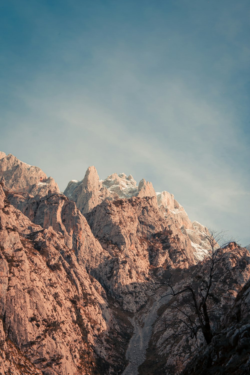 brown rocky mountain under blue sky during daytime