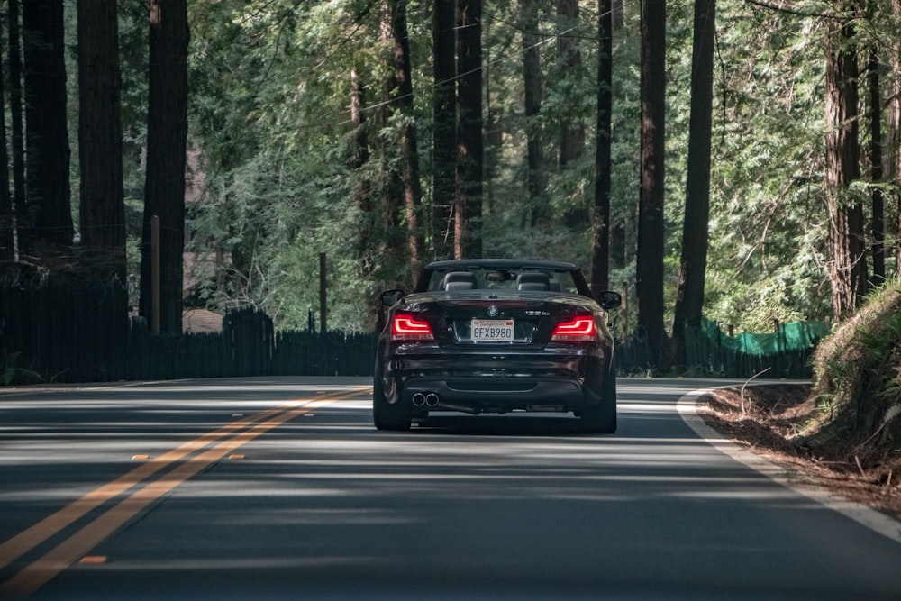 black car on road during daytime