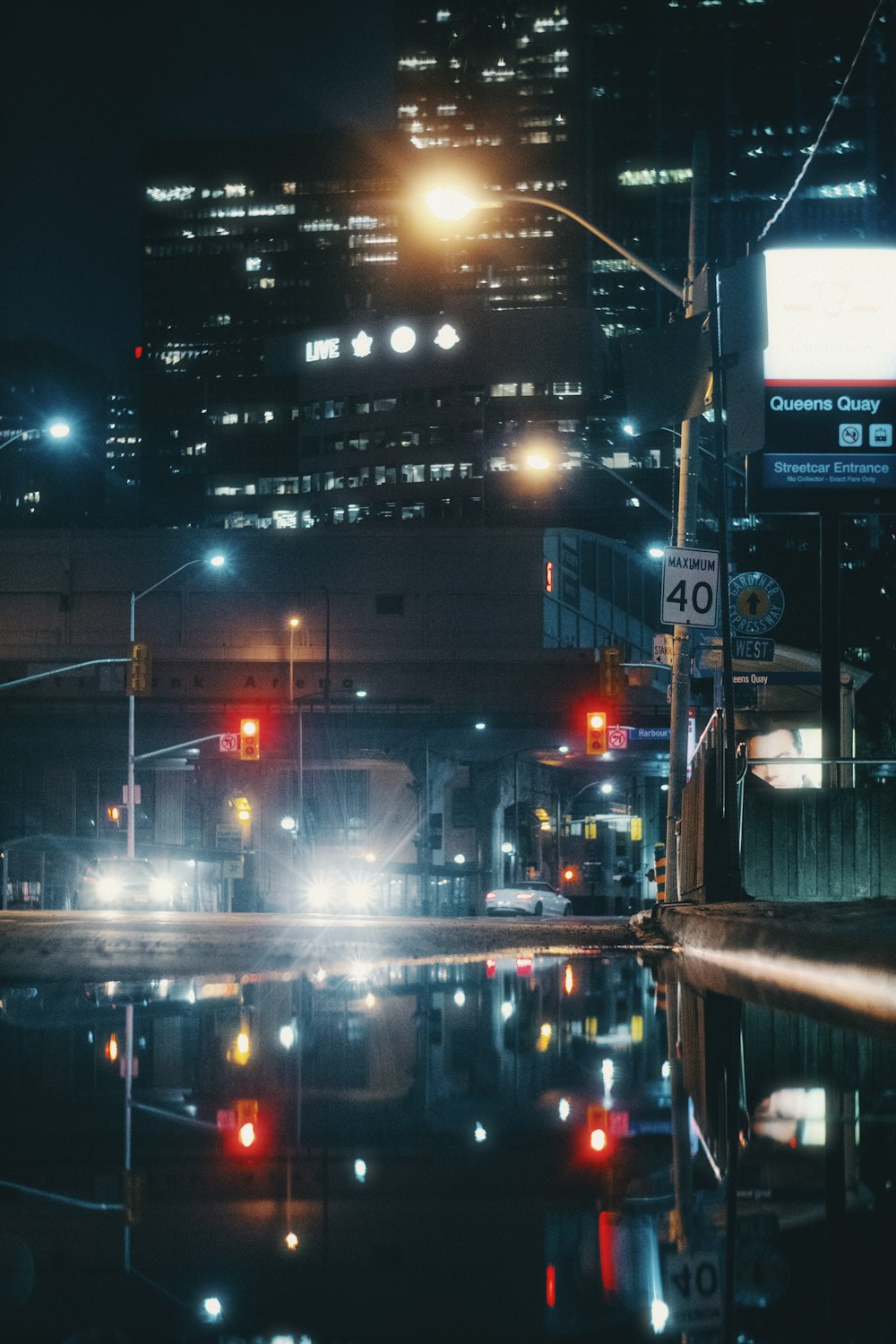 city buildings with lights turned on during night time