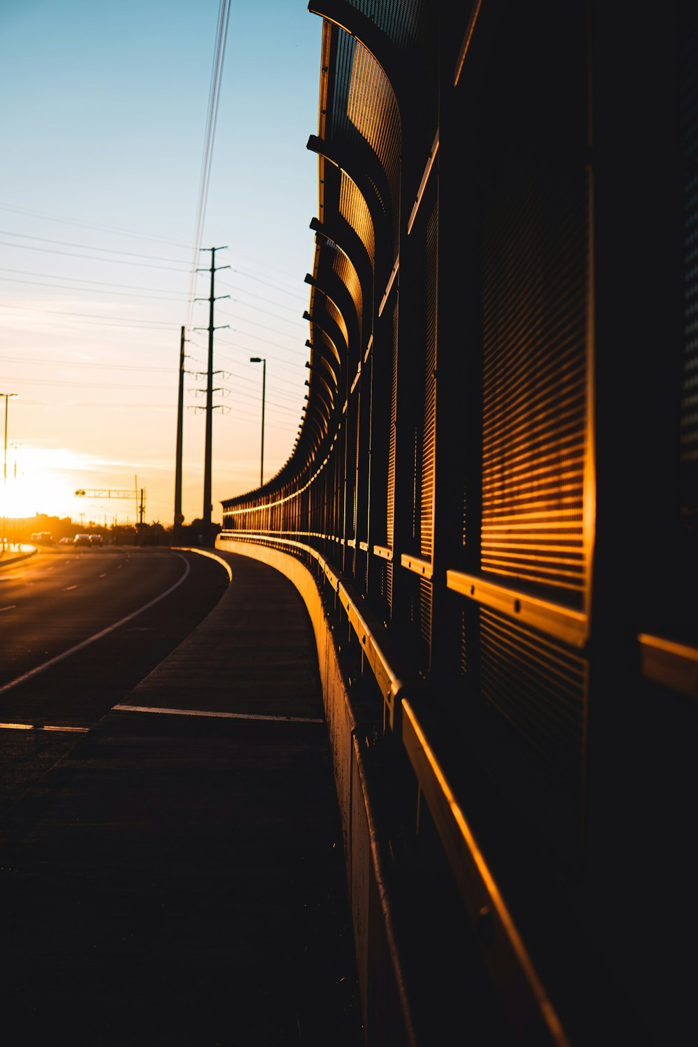 black and white train rail during sunset