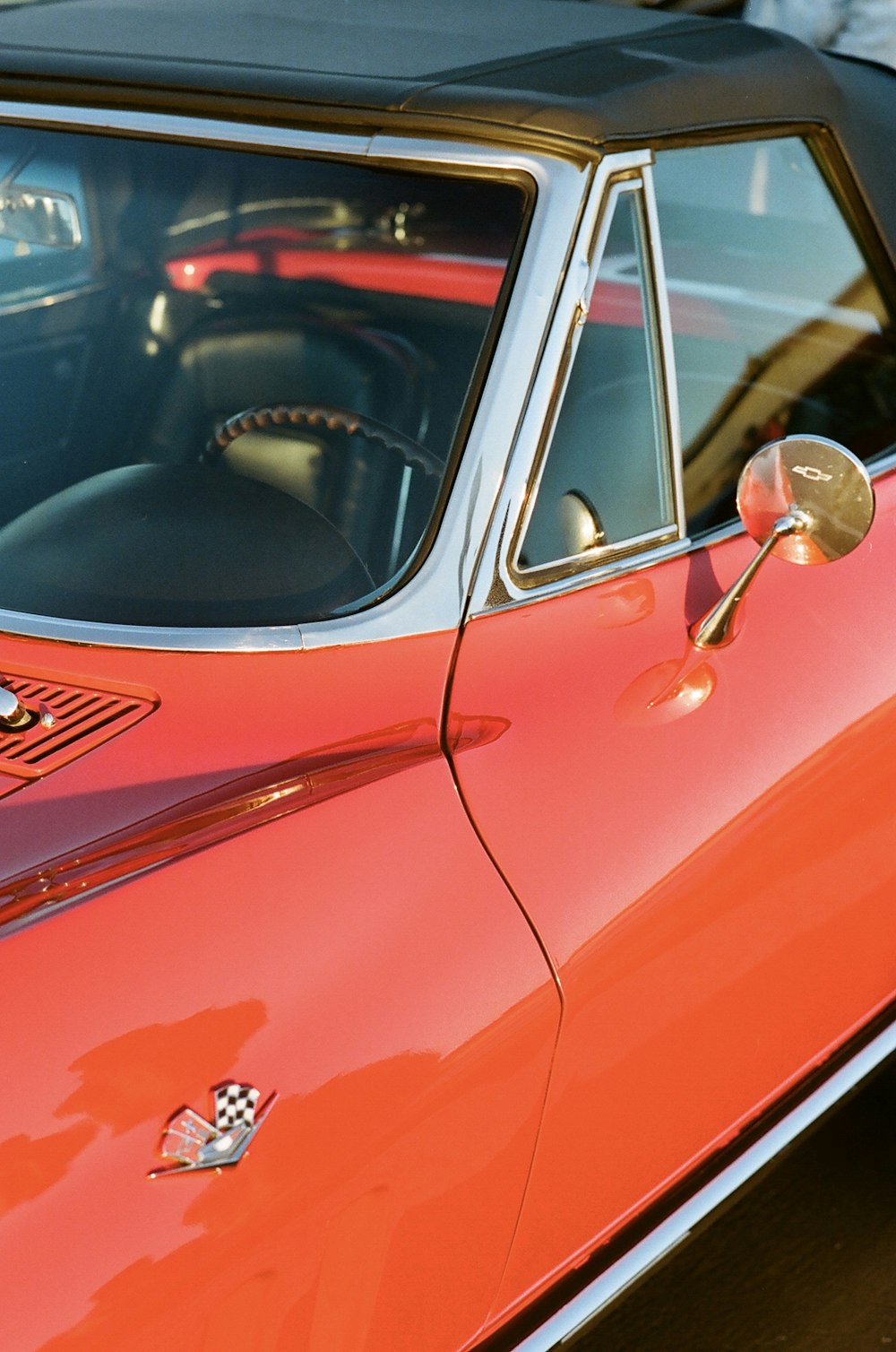 red car with silver door lever