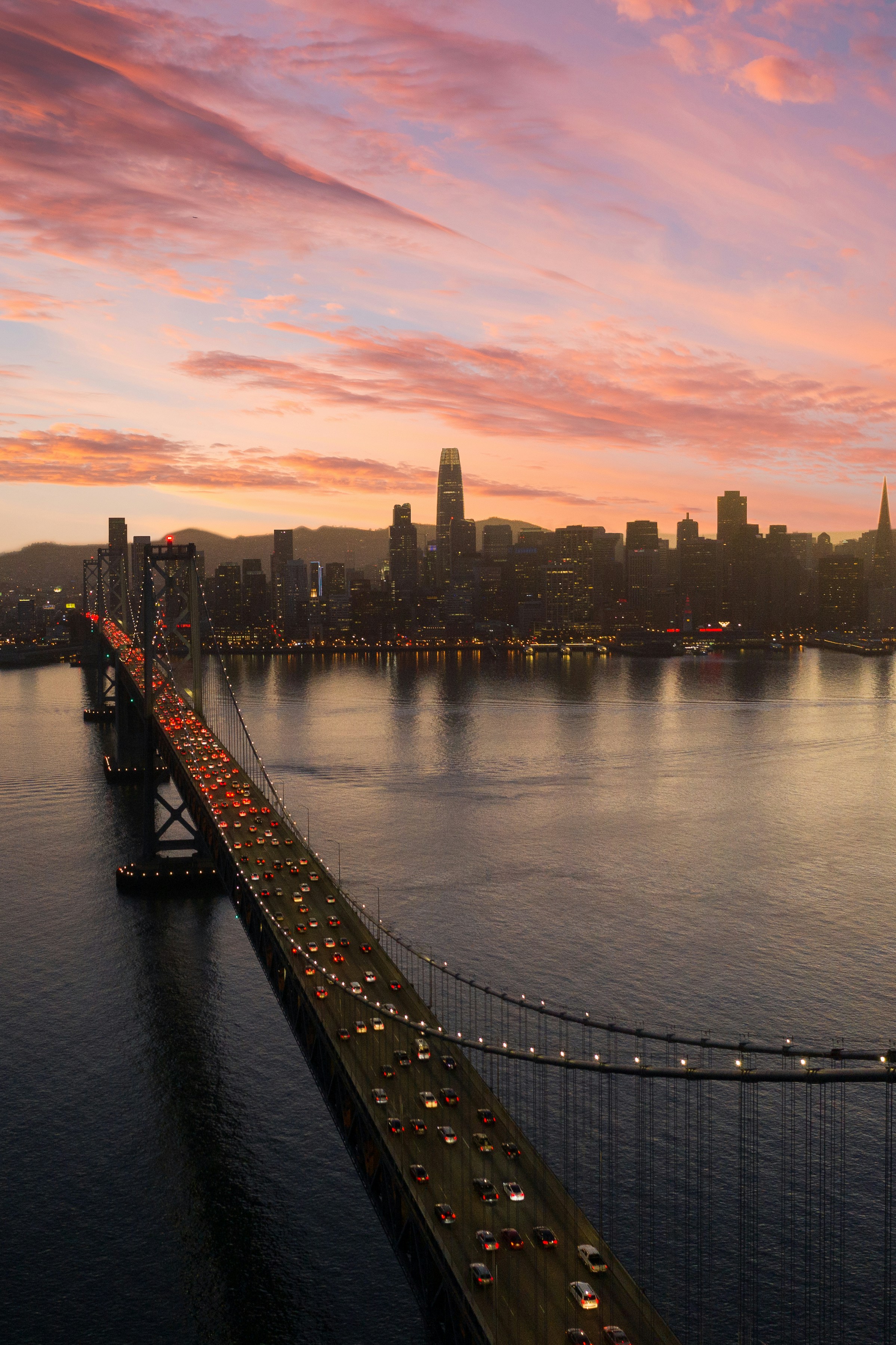 bridge over water near city buildings during daytime