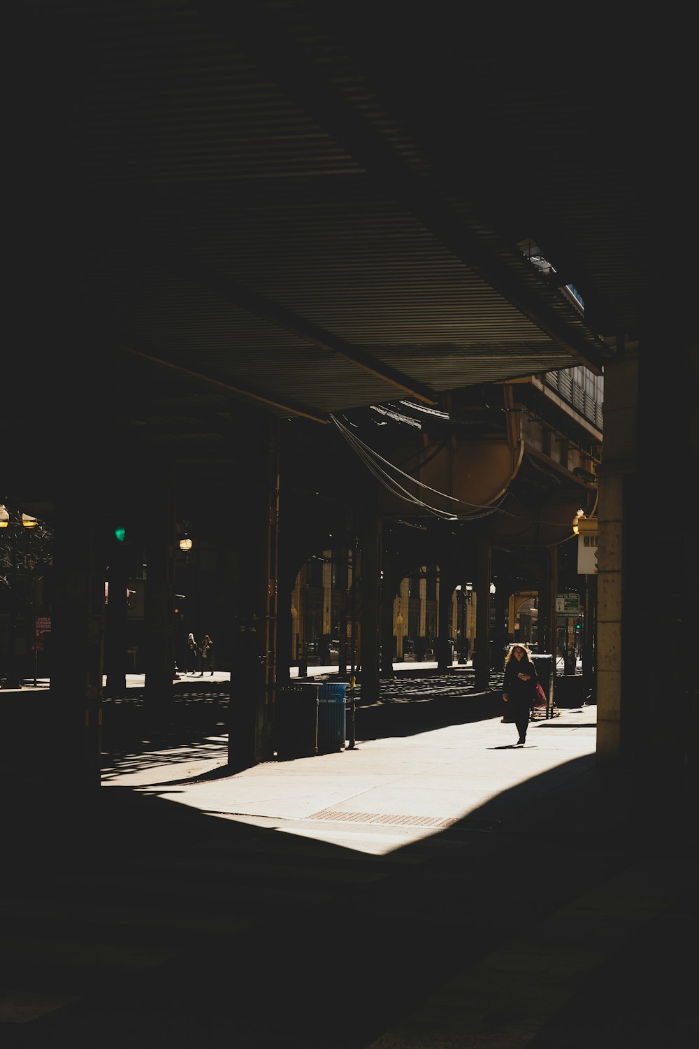 people walking on sidewalk during night time