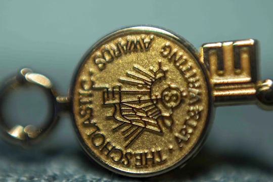 A student receiving a scholarship award certificate with a globe in the background.