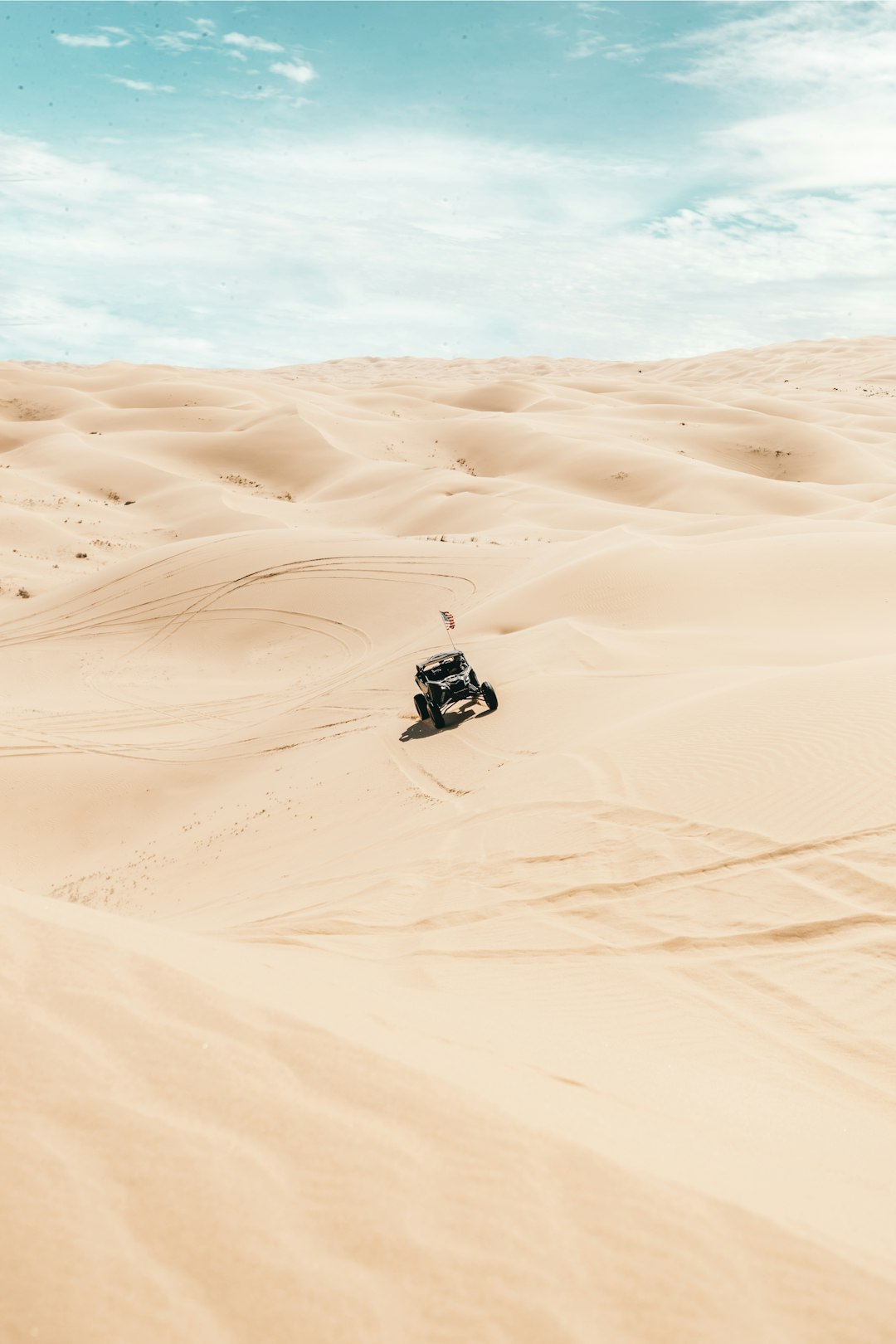 black and white car on desert during daytime