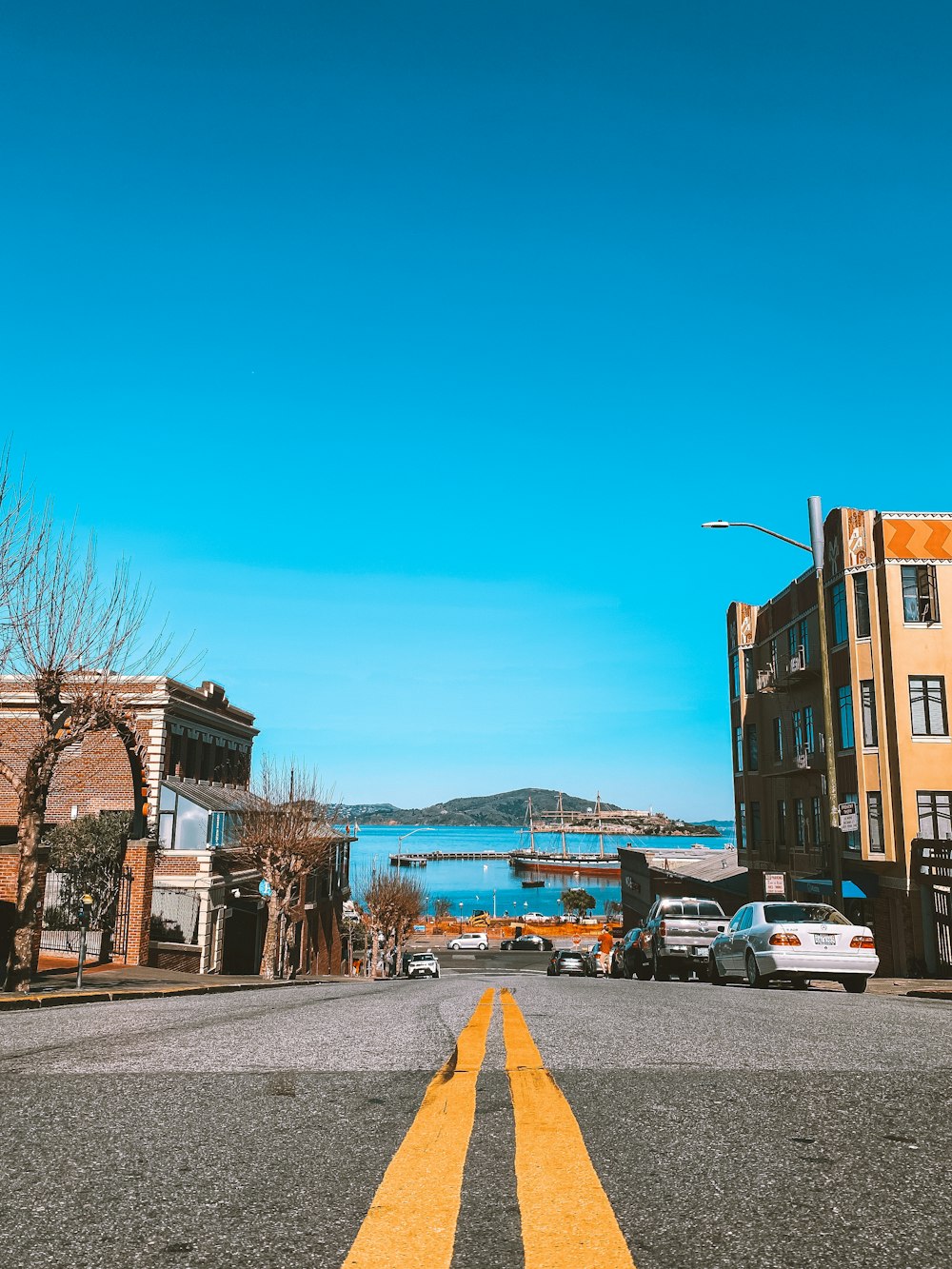 cars parked on side of the road during daytime