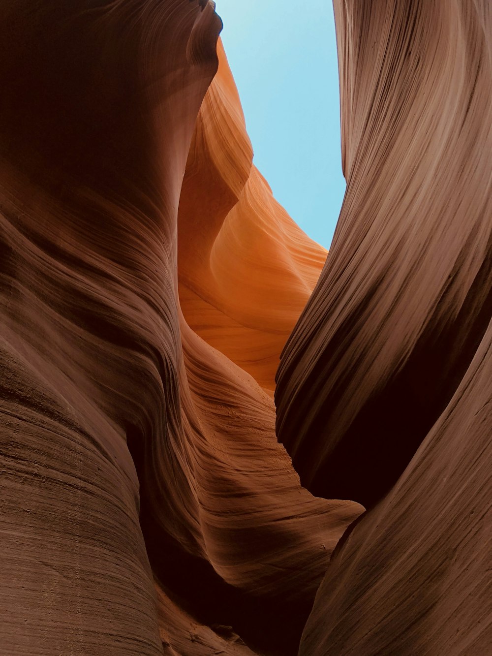 brown rock formation under blue sky during daytime