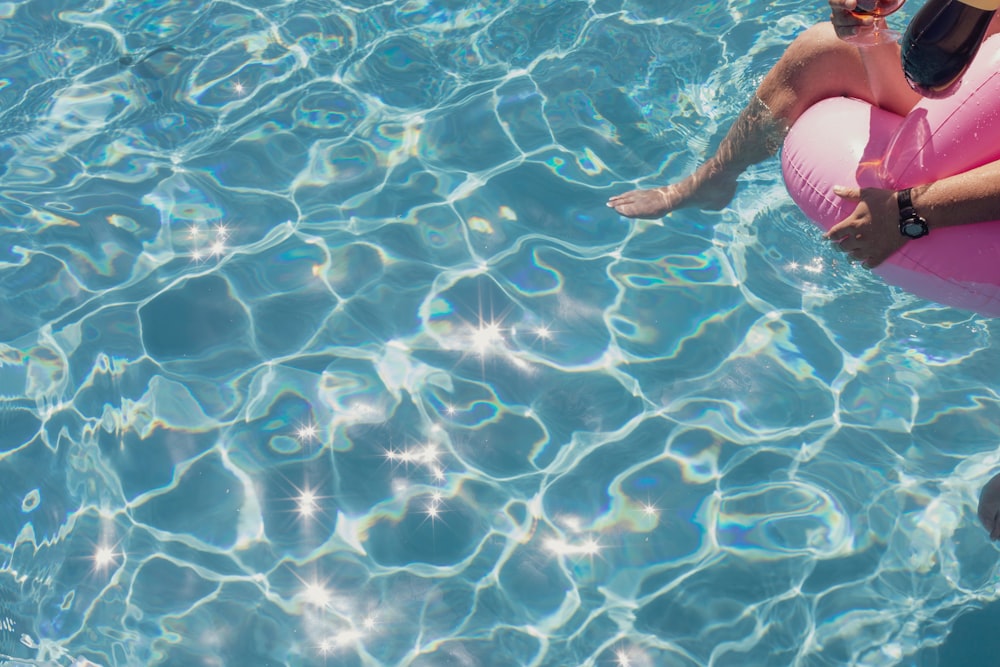 person in swimming pool during daytime