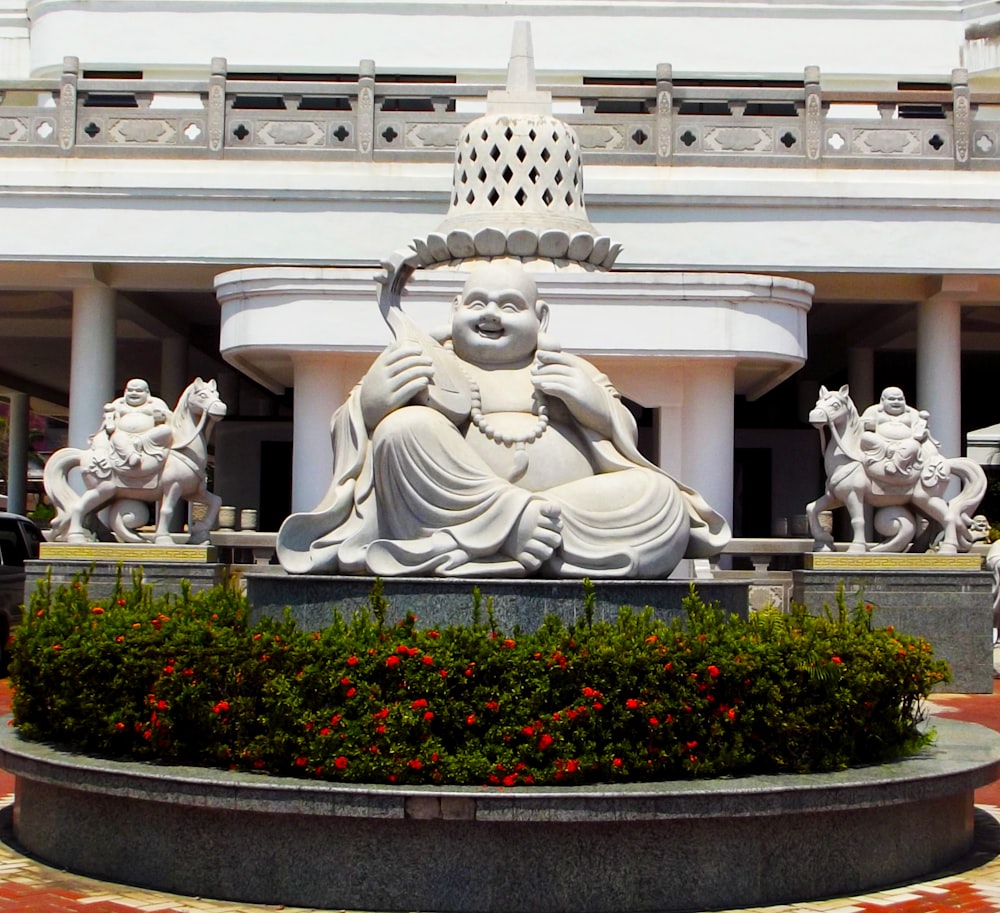 white concrete statue of man and woman