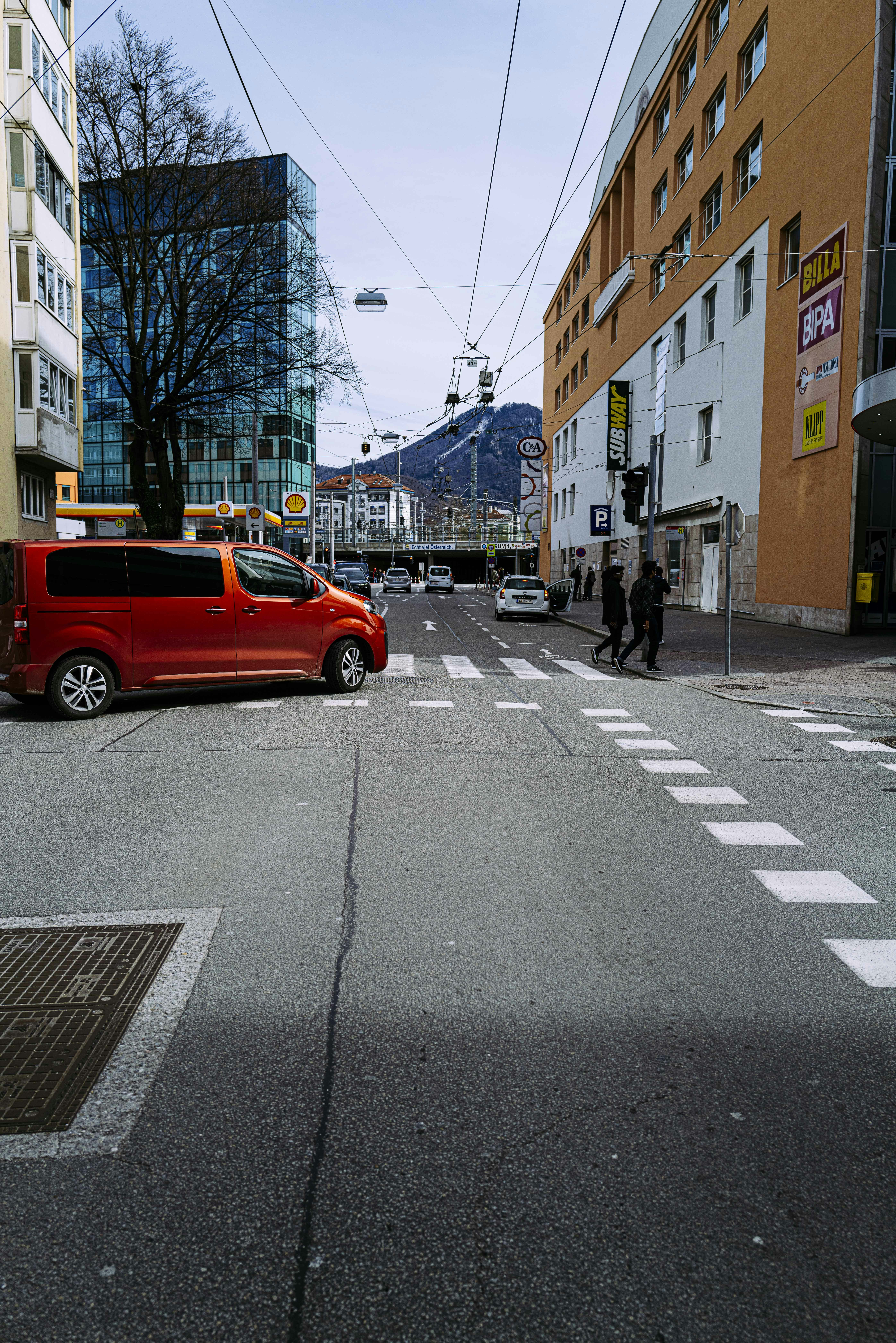 red car on road during daytime