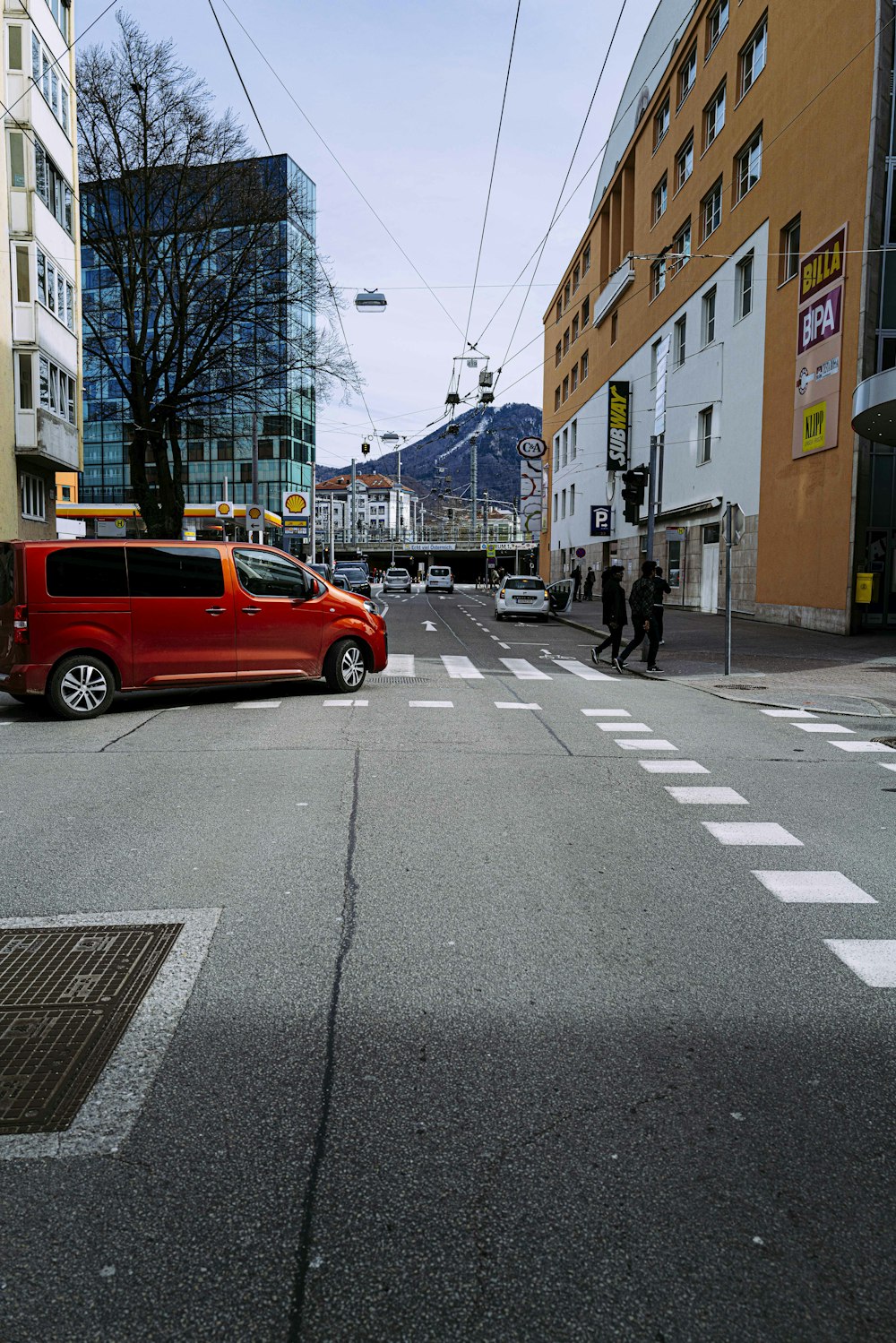 red car on road during daytime