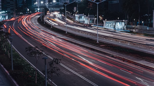 time lapse photography of cars on road during night time in Jakarta Indonesia