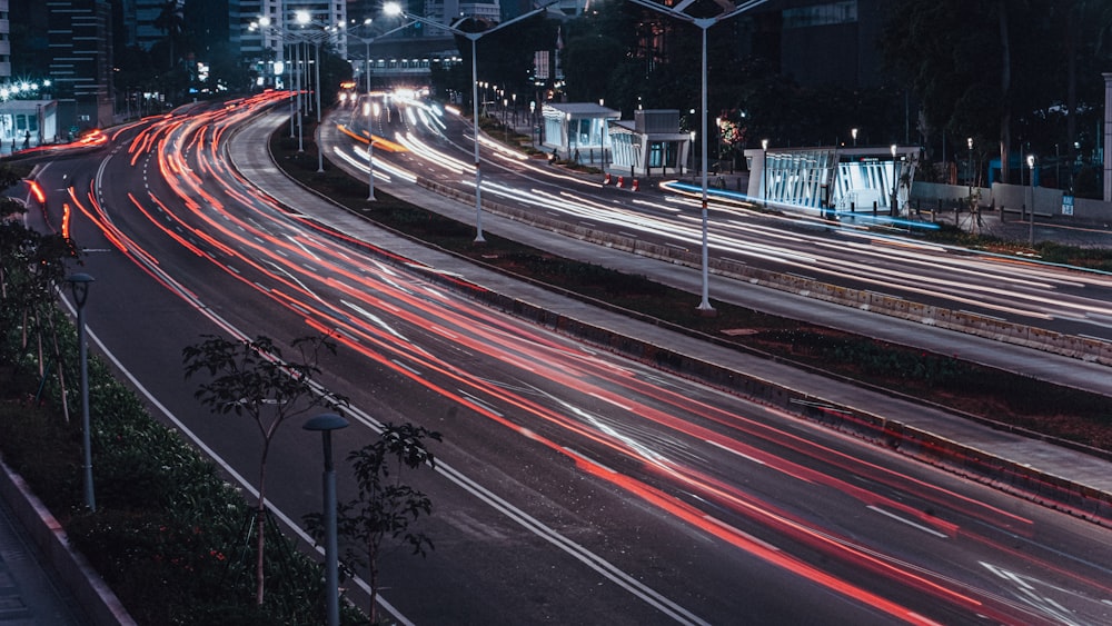 time lapse photography of cars on road during night time