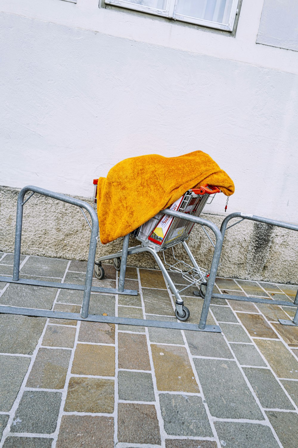 yellow textile on gray metal chair