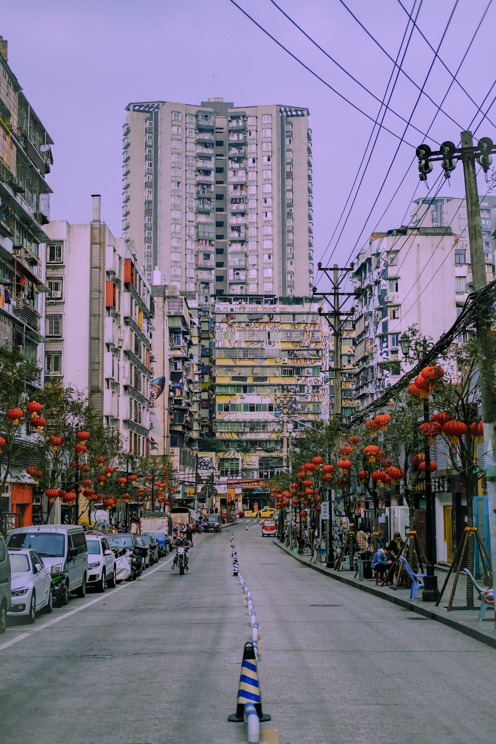 people walking on street near high rise buildings during daytime