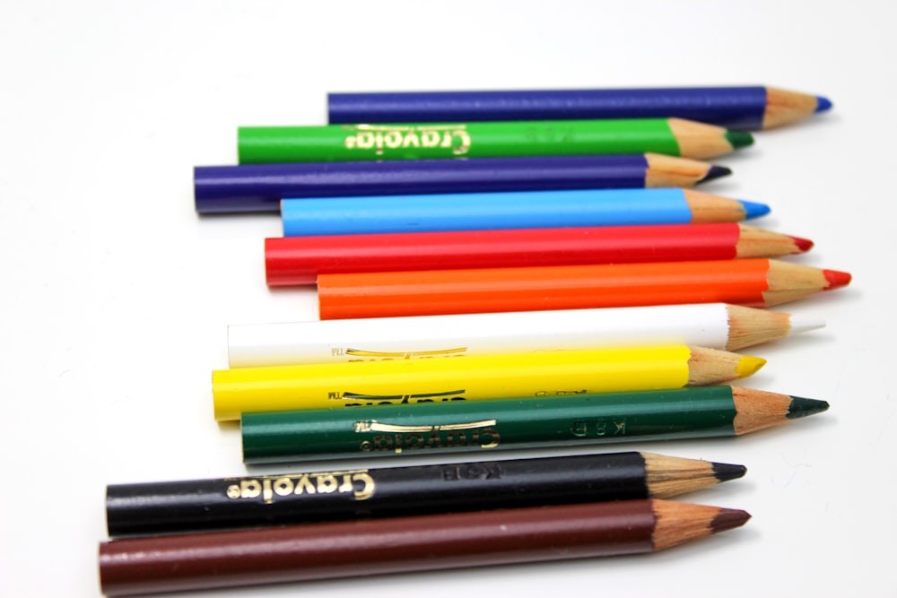 assorted color coloring pencils on white background