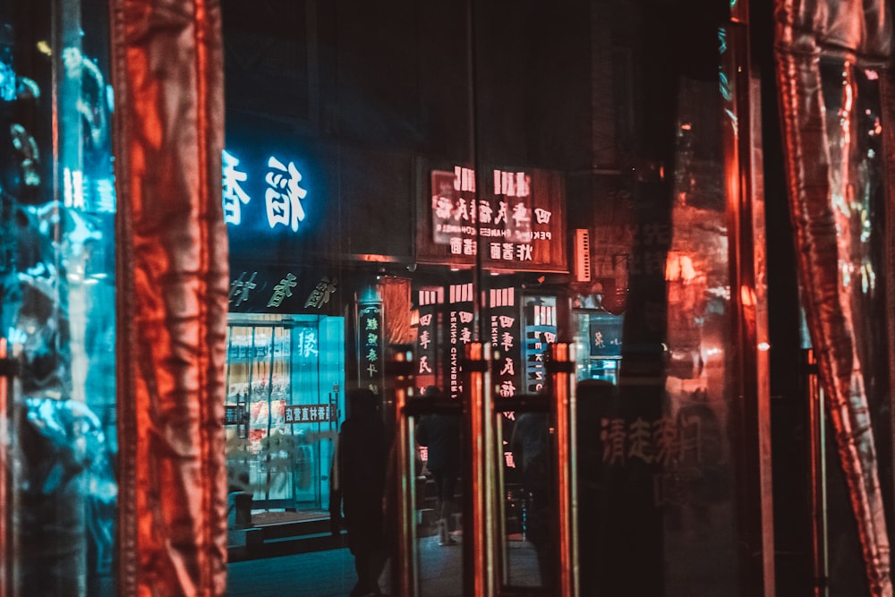 blue and red kanji text neon signage