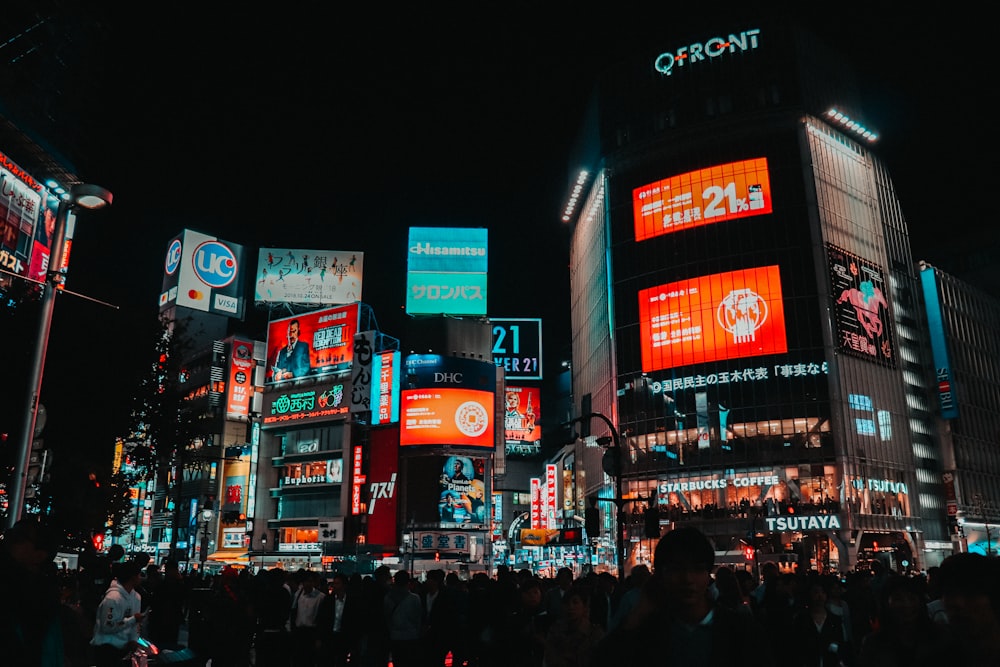 people walking on street during nighttime