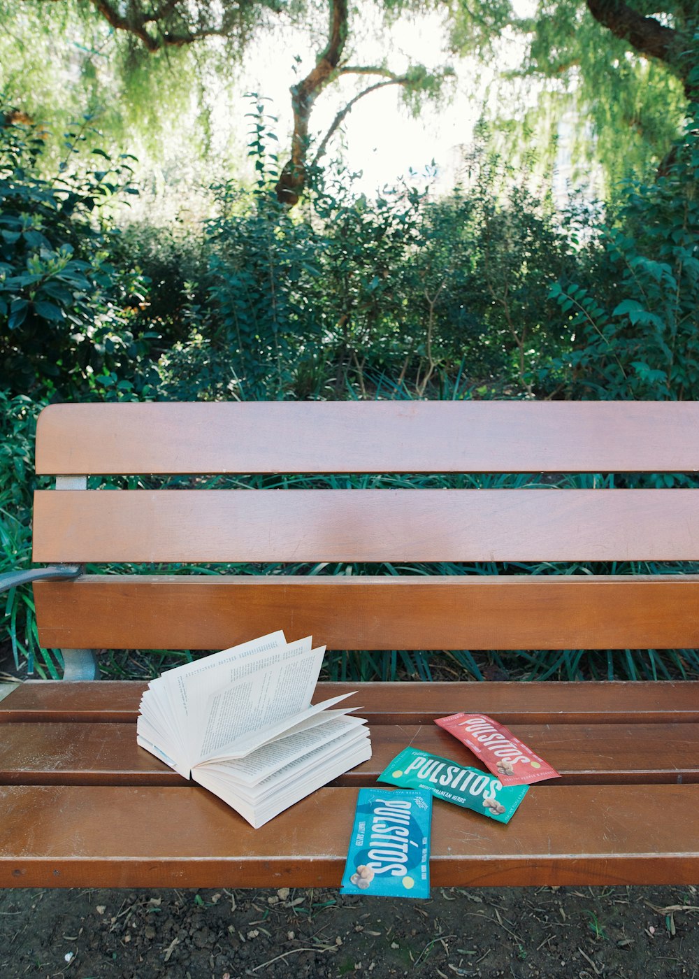 brown wooden bench with white textile on top