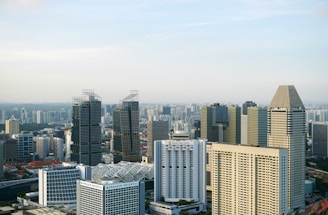 city buildings under white sky during daytime