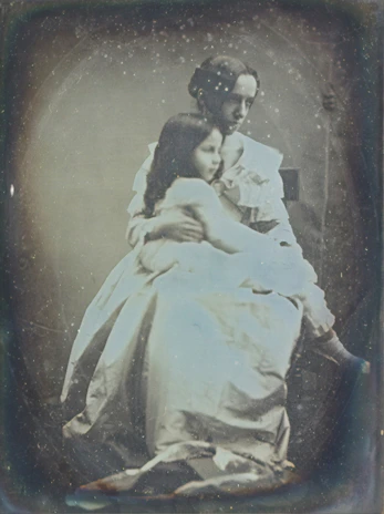 Vintage portrait of a Chilean family dressed in traditional clothing from the late 1800s.