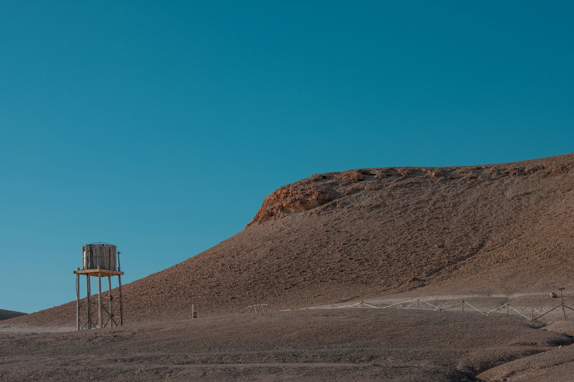 brown mountain under blue sky during daytime