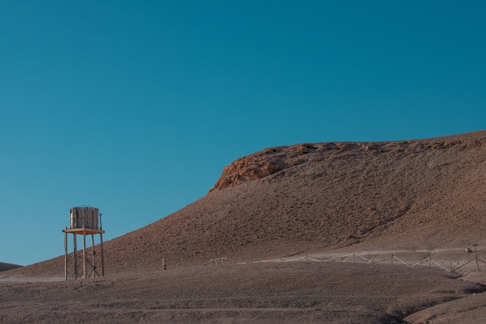 brown mountain under blue sky during daytime