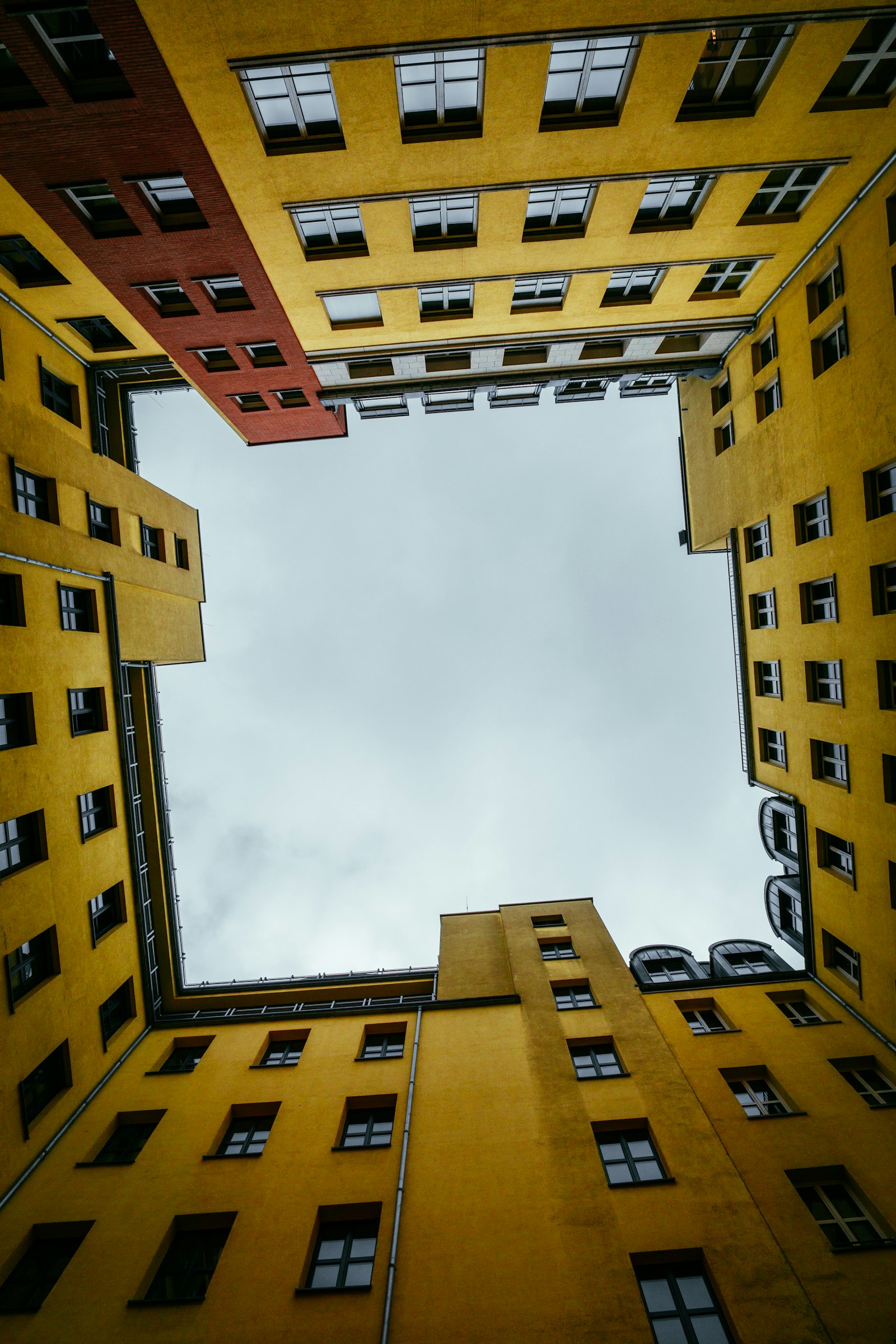 ZEISS Touit 12mm F2.8 sample photo. Brown concrete building under photography