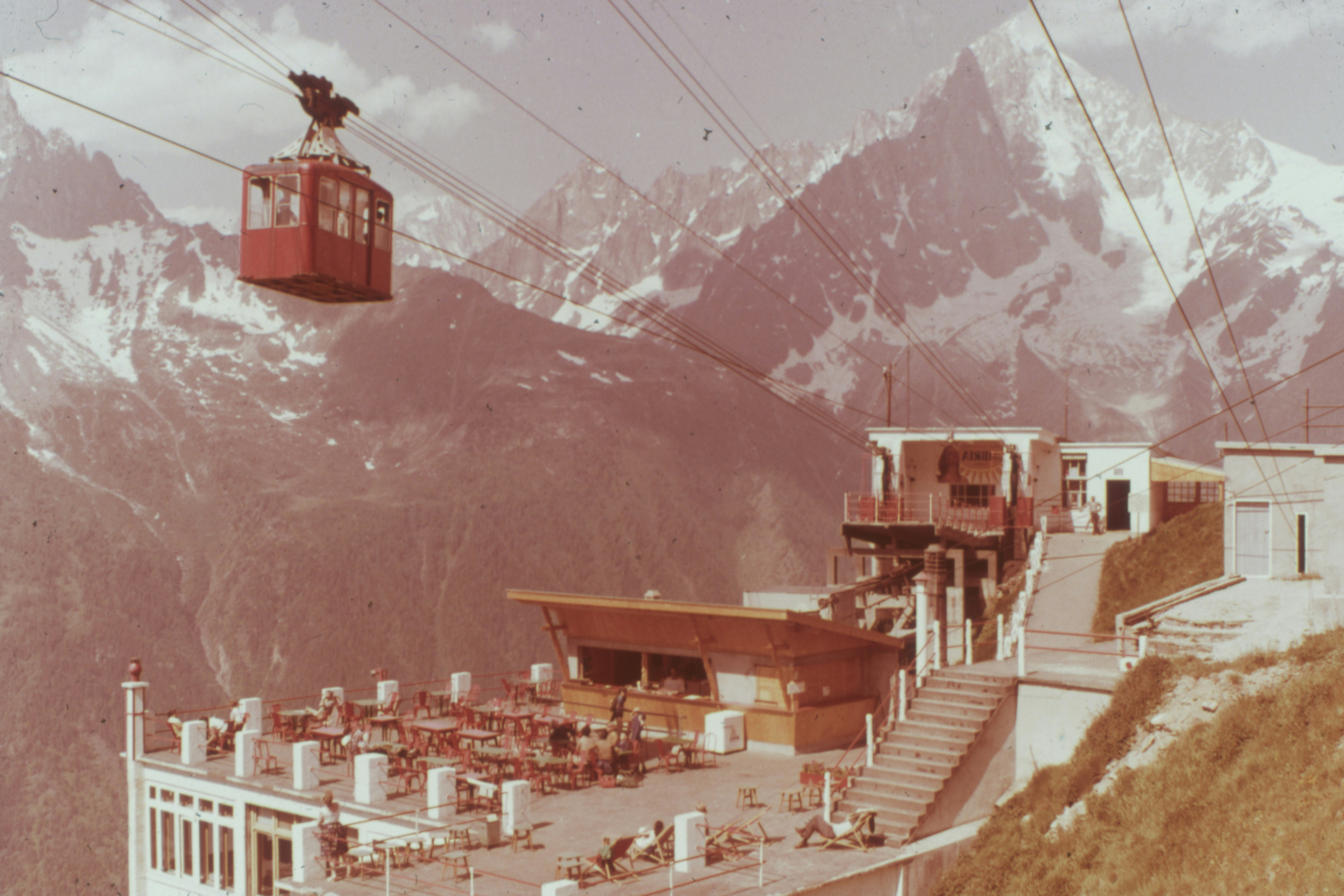 brown and white concrete buildings near mountain during daytime