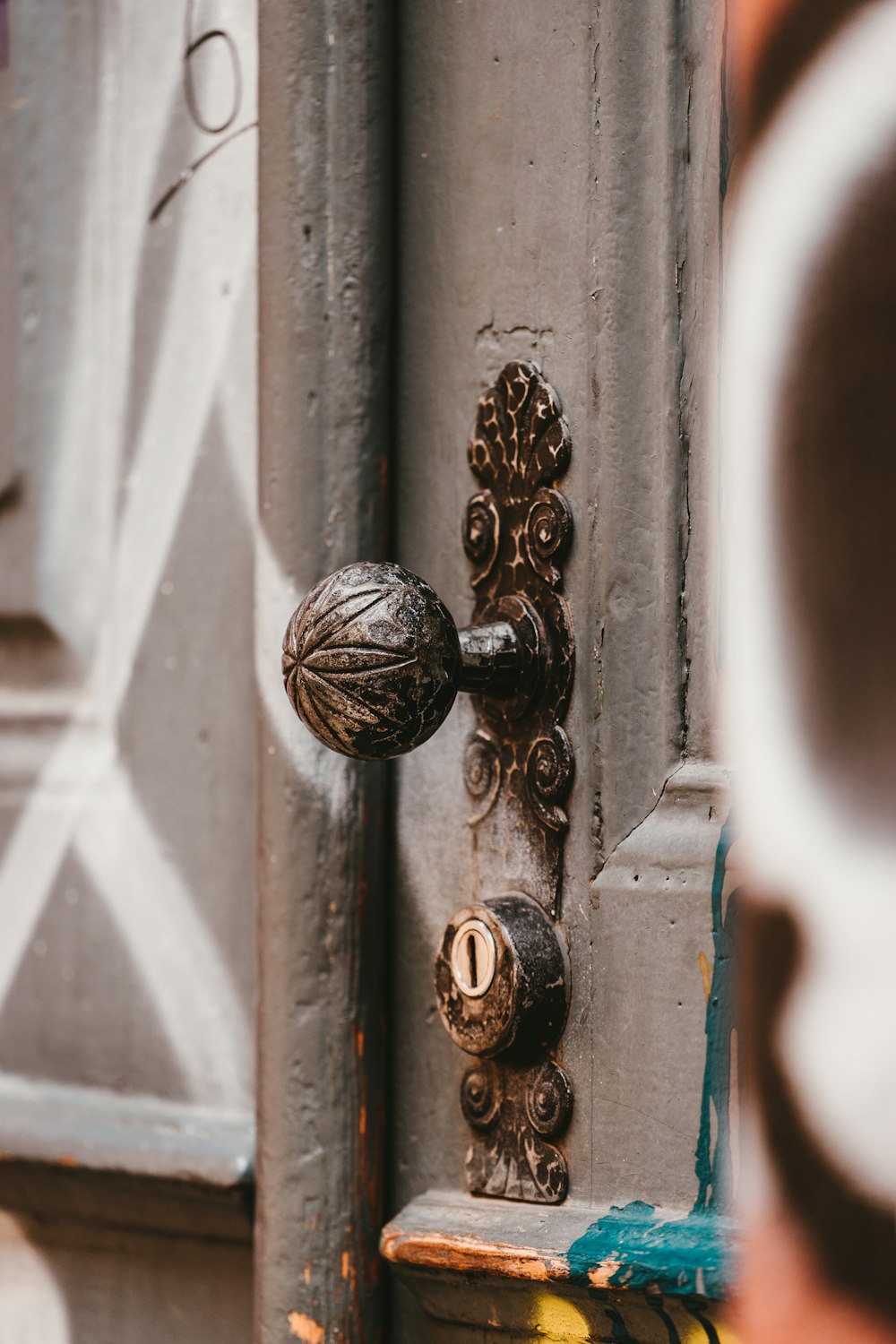 black door knob on white wooden door