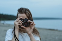 Close-up of a camera capturing a lively family moment at a beach destination.