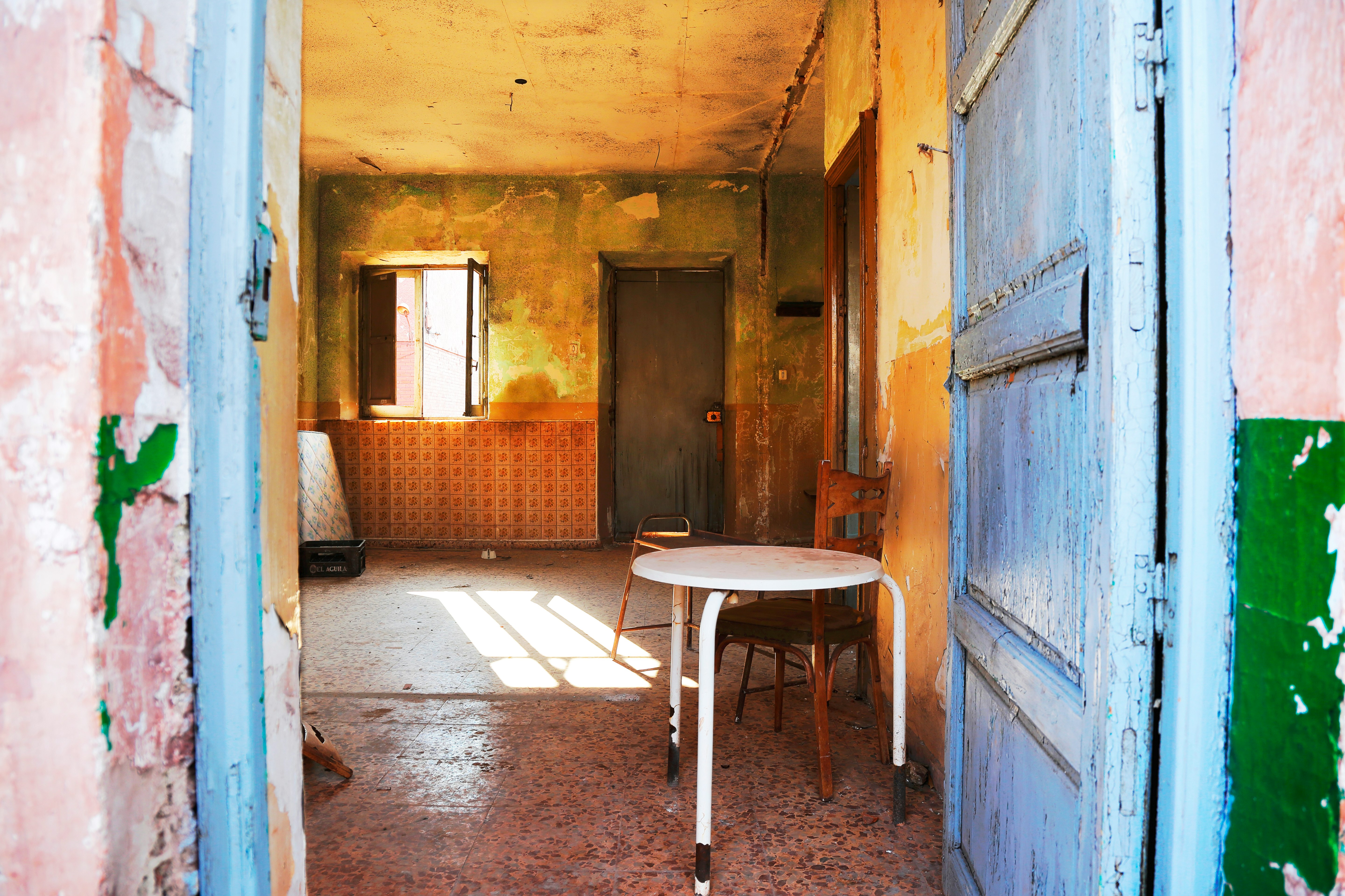 brown wooden table near brown wooden door