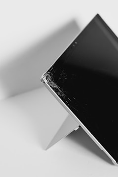 white android smartphone on white table